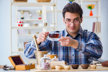 Fototapeta na wymiar Professional tea expert trying new brews