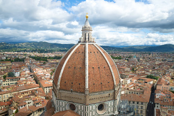 Fototapeta na wymiar Dome of the ancient cathedral of Santa Maria del Fiore over Florence on a cloudy September day. Italy