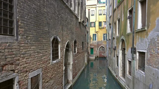 Old houses and narrow canal in Venice, Italy, 4k
