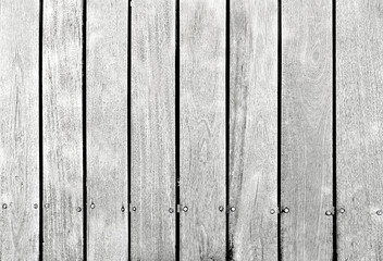 White wood texture or background plank with knots.
