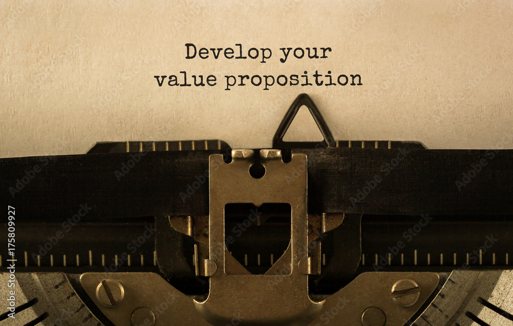 Poster text develop your value proposition typed on retro typewriter