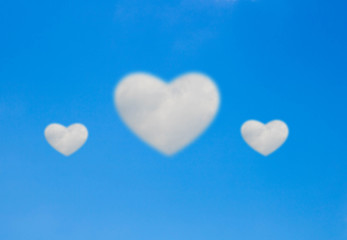Fototapeta na wymiar blue sky with Heart shaped cloud