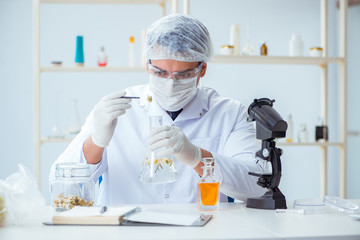 Chemist mixing perfumes in the lab