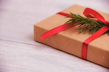 Gift box on wooden table background with copy space