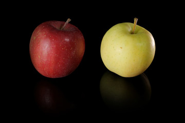 Japanese red and green apple on black