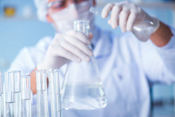 Female scientist researcher conducting an experiment in a labora