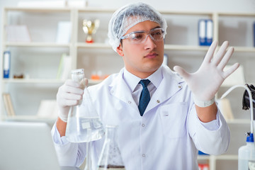 Young researcher scientist doing a water test contamination expe