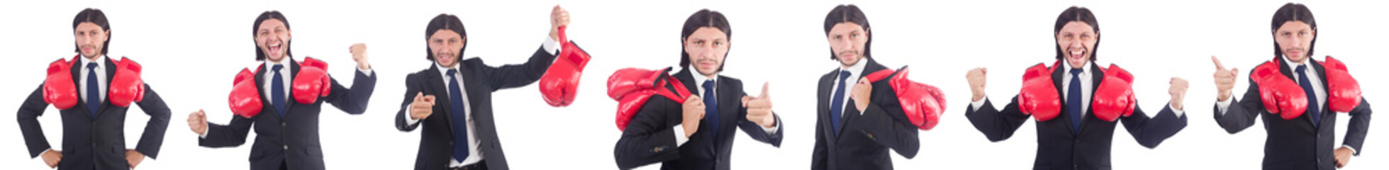 Businessman with boxing gloves on white