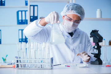 Female scientist researcher conducting an experiment in a labora