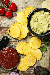 Mexican nachos chips with homemade fresh guacamole sauce and salsa