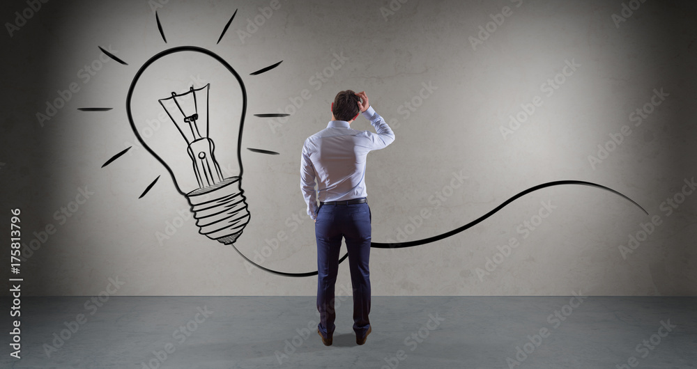 Poster businessman watching a lightbulb on a wall 3d rendering