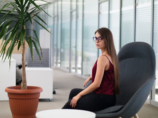 Girl in the hall is wating for an interview for work