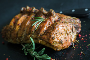 Pork loin on bone baked with herbs © Ruslan Mitin