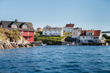 view on norwegian fjord with houses along coastline
