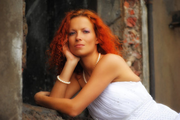 red-haired bride next to a ruined building