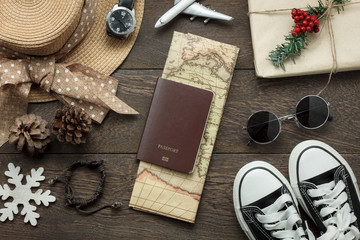 Table top view of ornaments and decorations Merry Christmas and Happy New Year with accessory travel concept background.Essential item on modern rustic home office desk.object prepare for travelling.