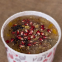 Turkish dessert Asure Ashure from boiled cereals with dried fruits and pomegranate grains