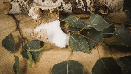Xylitol - sugar substitute. Birch sugar on wooden background.