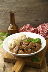 Traditional homemad beef goulash with dumplings
