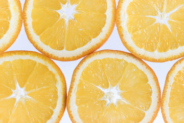 Abstract background with citrus-fruit of orange slices. Close-up. Studio photography.