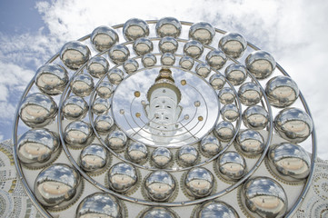 Big ball glass and white buddha statue
