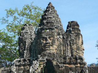 Stone faces over the East City Gate, Anglor Wat, Siem Reap, Cambodia