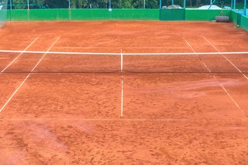 Large clay tennis court without people