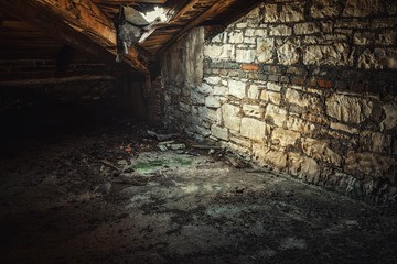 Creepy attic interior at abandoned building