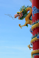 Chinese dragon in front of blue sky.