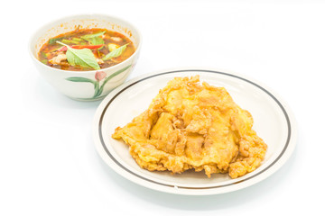 Thai spicy chicken soup  with omelet and rice