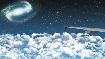 commercial airplane flying above clouds in dramatic night sky with star and galaxy constellation. beautiful night flight experience. international passenger flight, travel concept background