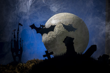 Halloween, cat and bats against the background of the moon