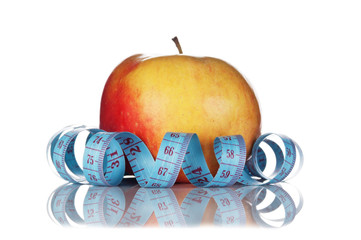 blue measure tape and red apple  isolated