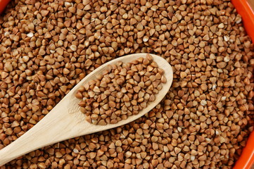 buckwheat groats and wooden spoon
