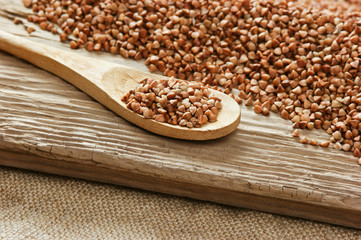 buckwheat groats and wooden spoon