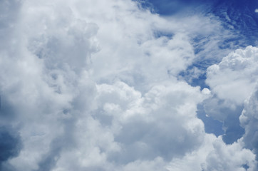 Blue sky background with white clouds.