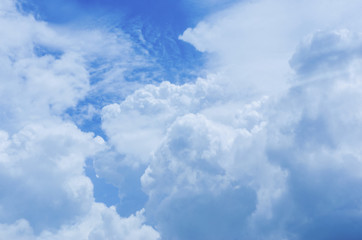 Blue sky background with white clouds.