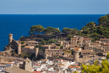 Obraz premium View of the town of Tossa de mar one of the most beautiful towns on the Costa Brava. City walls and medieval castle on the hill. Amazing city in Girona, architecture and monuments of Catalonia.