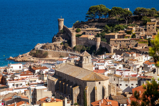 View of the town of Tossa de mar one of the most beautiful towns on the Costa Brava. City walls and medieval castle on the hill. Amazing city in Girona, architecture and monuments of Catalonia.