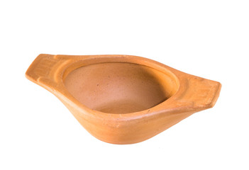 Earthen bowl handmade from clay,closeup shot on white isolated. 