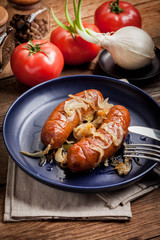 Fried sausage with onions.