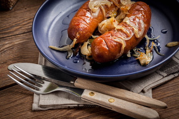 Fried sausage with onions.