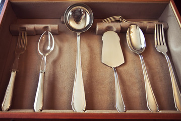 Vintage silver flatware set composed by service forks, spoon, ladle, salad servers and pie server