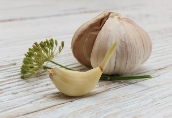 Garlic on a white wooden board