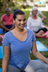 Portrait of smiling trainer with senior people