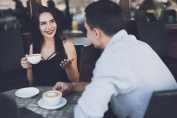 Talking with a man in a restaurant