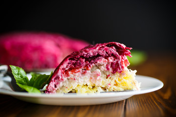 layered pastry salad with herring and beetroot