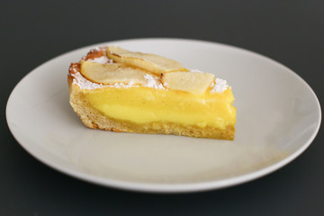 slice of pastry cream pie with apples