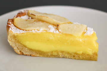slice of pastry cream pie with apples