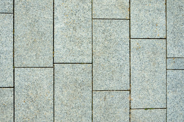 Pavement Tiles from Granite Stone. The Texture of Natural Stone in the Decoration of Street Spaces